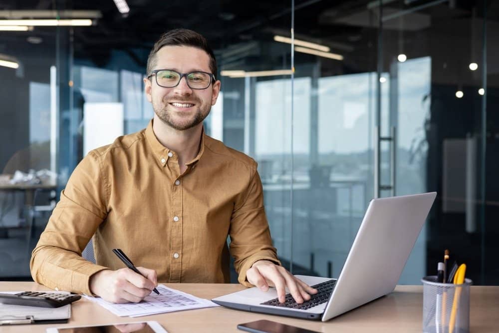 Portrait,Of,Young,Businessman,In,Shirt,,Man,Smiling,And,Looking