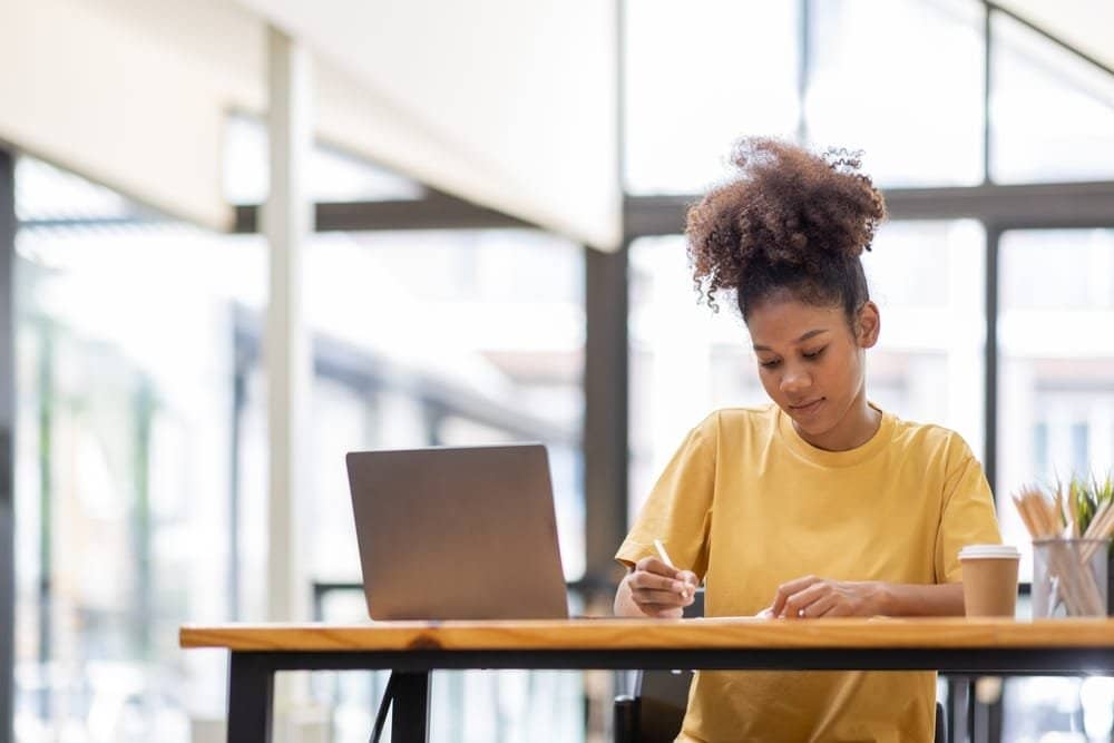 Business,And,Education,Concept.,Smiling,African,American,Sitting,At,Desk