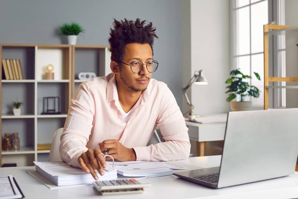 Young,African,American,Business,Man,Accountant,Working,On,A,Laptop