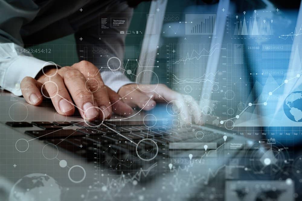 Close,Up,Of,Business,Man,Hand,Working,On,Blank,Screen